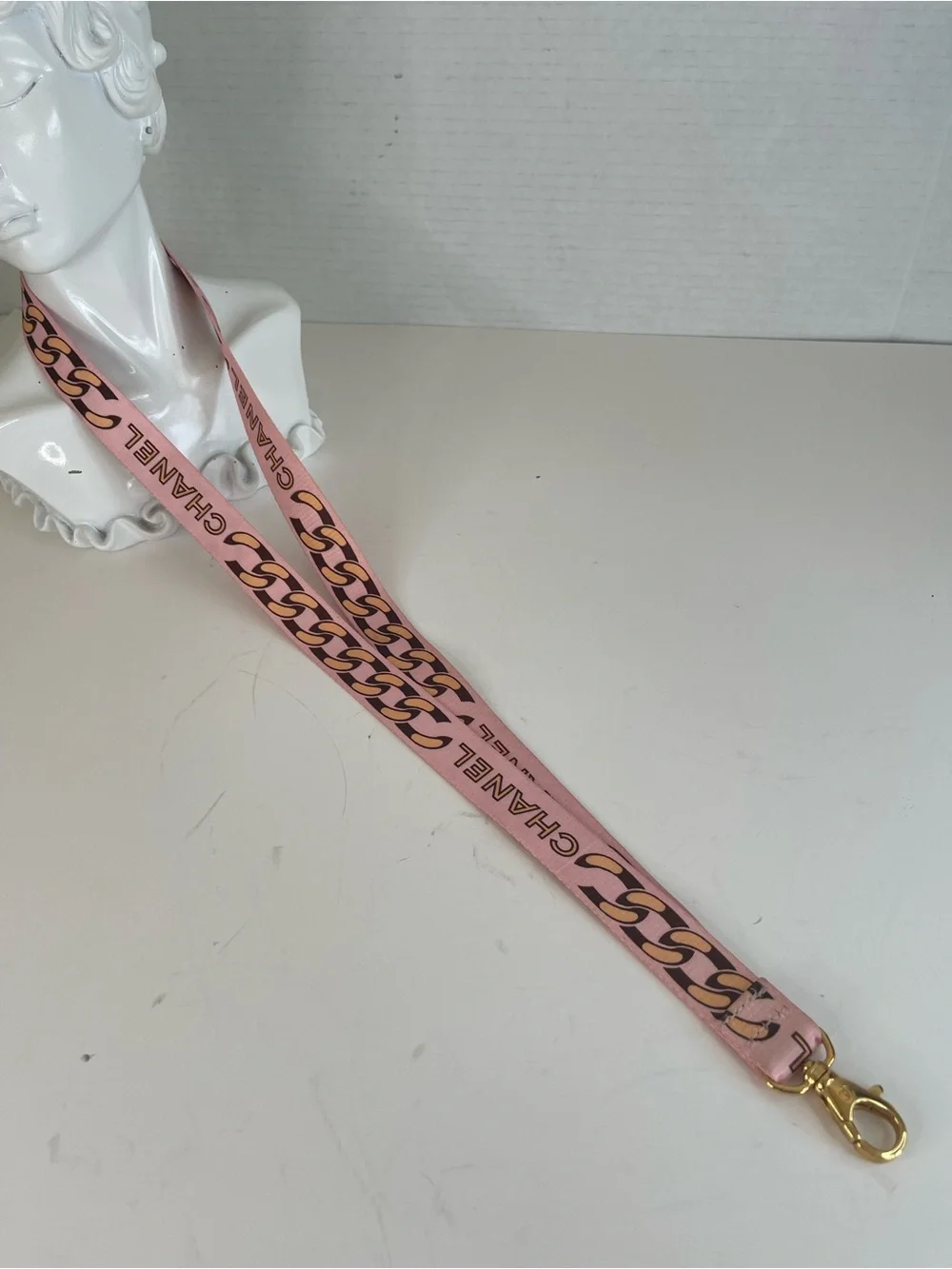 CHANEL Pink Chain-Print Lanyard with Gold Hardware